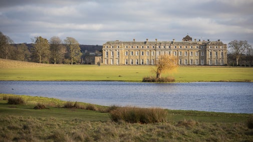 View across Upper Pond towards the mansion at Petworth House and Garden, West Sussex
